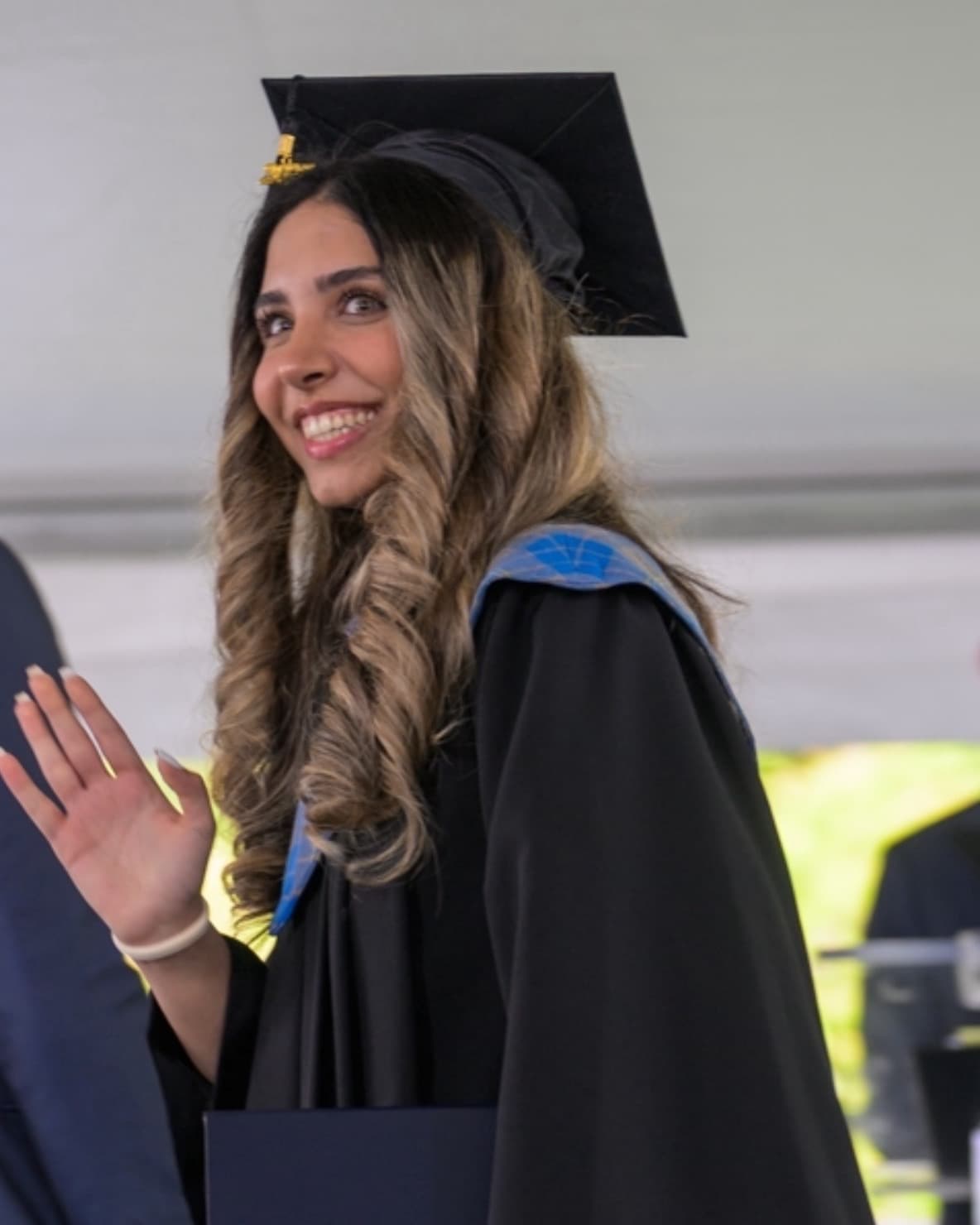 Nika Sahih on her graduation day, in cap and gown
